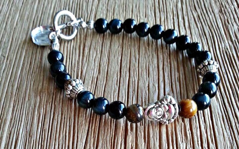 Silver laughing buddha charm with 6mm blue and brown tiger's eye beads. Beaded bracelets for men and women.