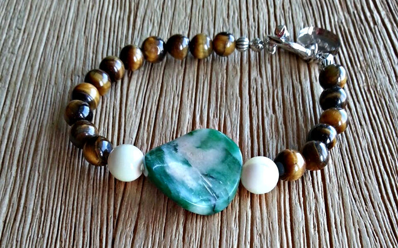 African Jade disc with 6mm gold tiger's eye and 8mm seawater mother of pearl beads. Beaded bracelets for men and women.