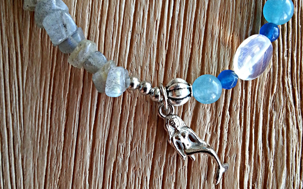 Silver mermaid charm with rutilated grey moonstone chips, 6mm amazonite, 4mm blue cut agate and round disc moonstone beaded bracelet - close-up of mermaid charm.