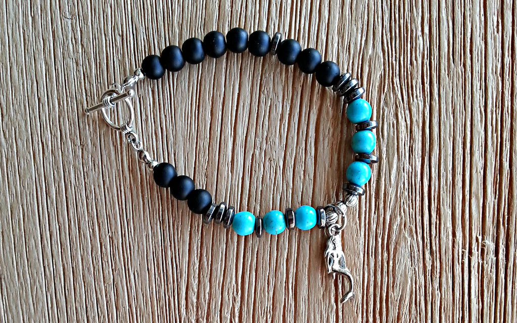 Silver mermaid charm with 6mm turquoise howlite, matte black obsidian beads and hematite discs