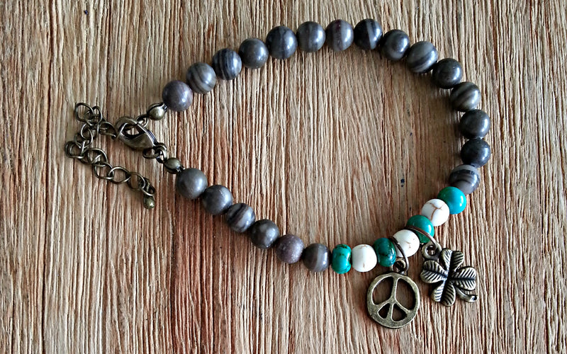 Peace and 4-leaf clover charms with 6mm wooden jasper beads, turquoise discs and howlite beads