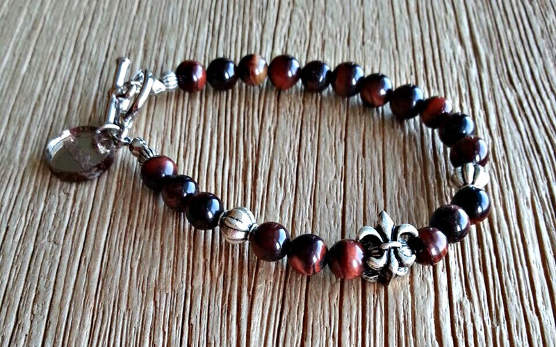 Silver Fleur de Lis charm with 6mm red tiger's eye beads