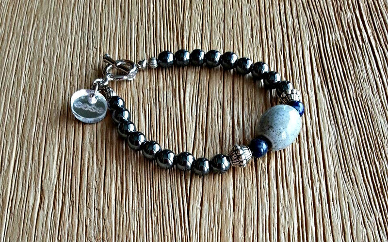 Ceramic bead with 6mm lapis lazuli, silver and hematite beads. Beaded bracelets for men and women.