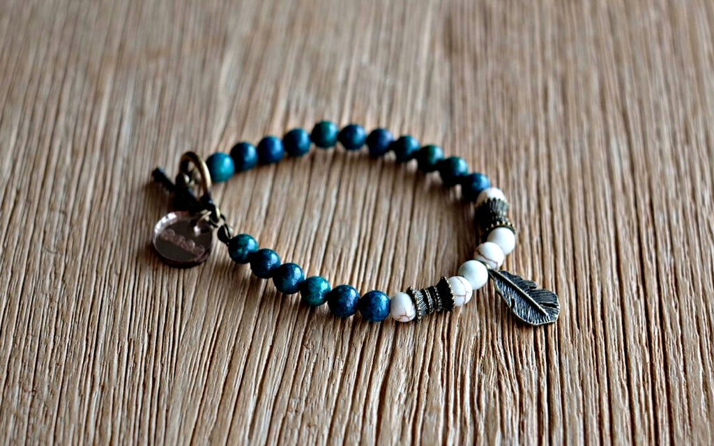 Antique brass feather charm with 6mm adulite and howlite beads. Beaded bracelets for men and women.