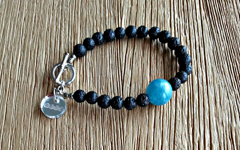 6mm lava stones with a 14mm sky blue amazonite bead. Beaded bracelets for men and women.