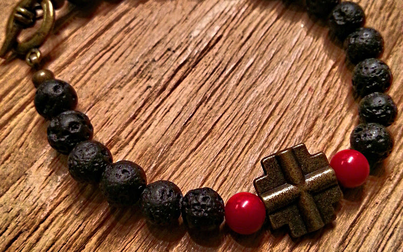 6mm black lava stone, red coral beads and brass cross charm bead bracelet